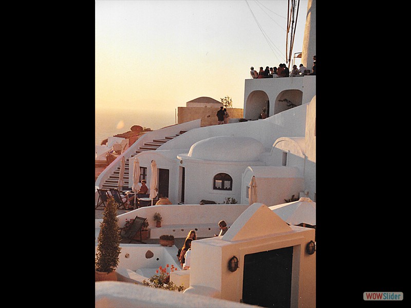 Santorini neighbors celebrating sunset